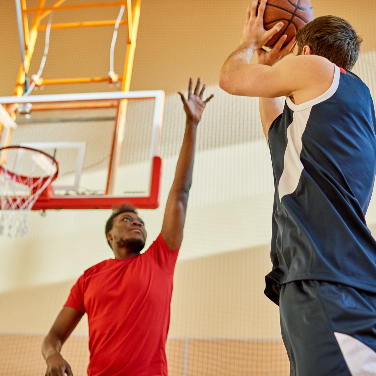 young men playing basketball